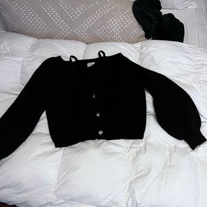 Black cropped off the shoulder sweater.
